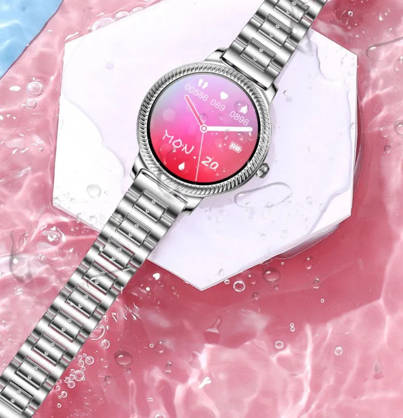 AK38 ladies smart watch with stainless steel band on a wrist, showing its 1.09-inch screen.