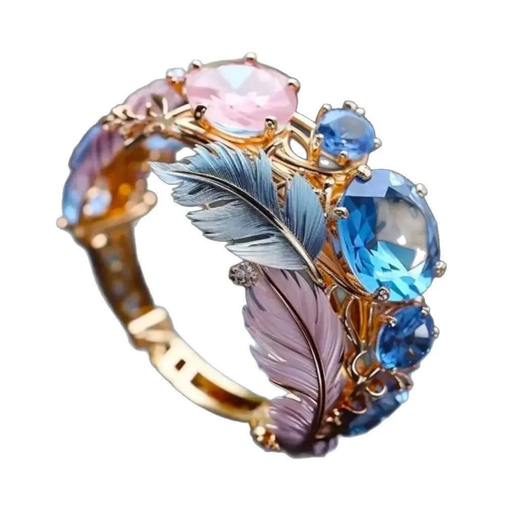 Gold geometric brass ring with colourful embossed feather design and zircon inlay
