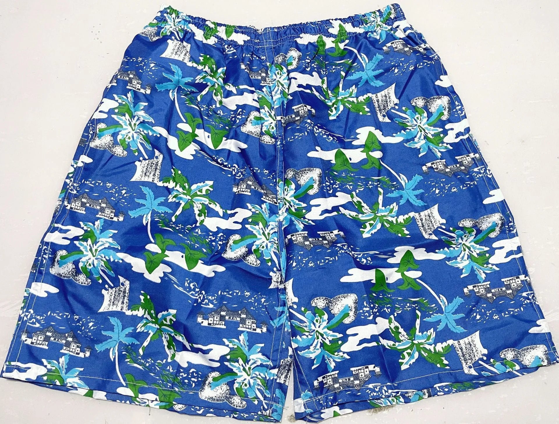Men's floral printed swimming trunks in polyester with five-point design for beach and pool use
