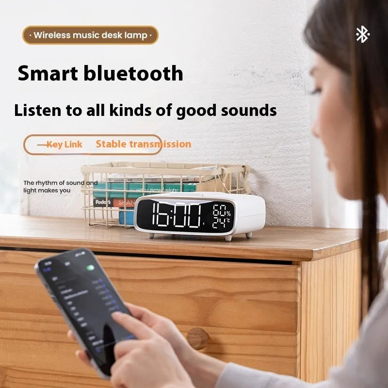 White wireless charging pad with Bluetooth speaker and night light functions