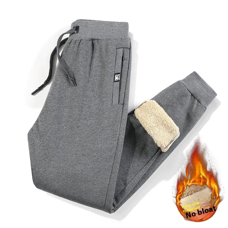 Men's grey fleece-lined cotton track pants with oversized fit and straight leg design