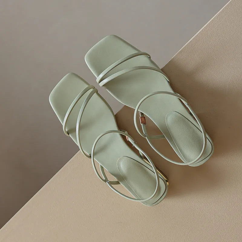 Women's flat strap open-toe Roman sandals in microfiber with a square toe, shown in beige, green and white.