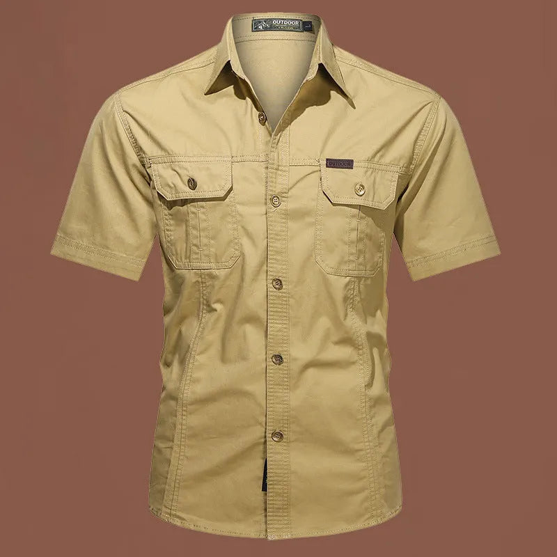 Man wearing a loose-fitting short sleeve cotton work shirt in a cardigan style.