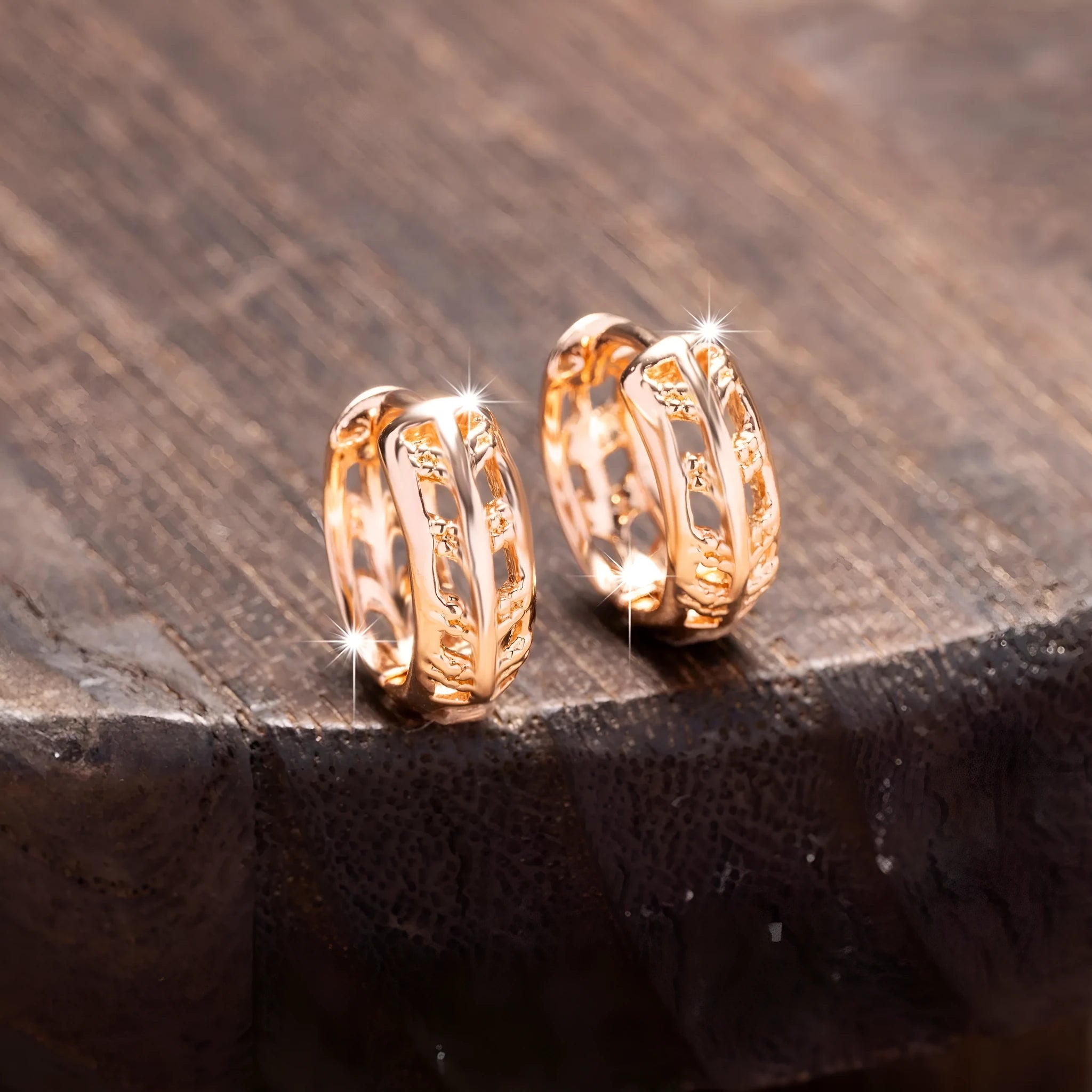 Rose gold plated copper earrings with hollow heart and leaf shapes, shown from front, approx 2.5cm tall.