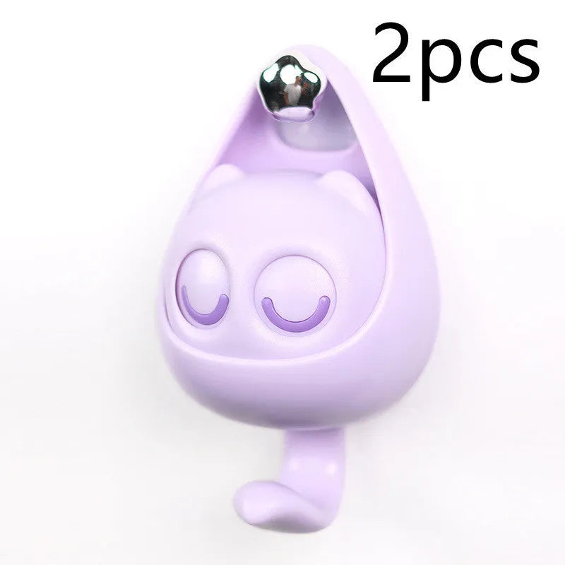 Cream white cat-shaped adhesive wall hook with winking eyes, 2.5kg capacity, 105x61x45mm