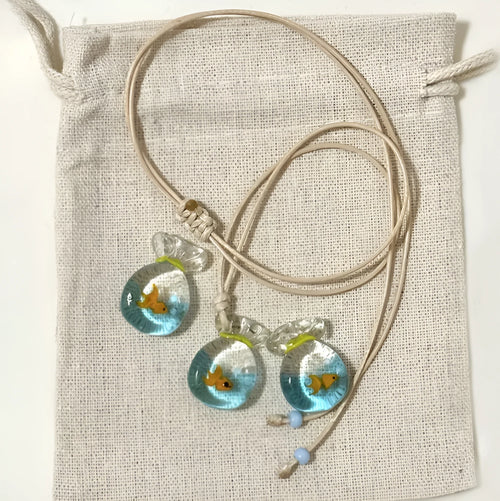 Women's joker pendant necklace on braided cotton linen cord with adjustable lobster clasp.