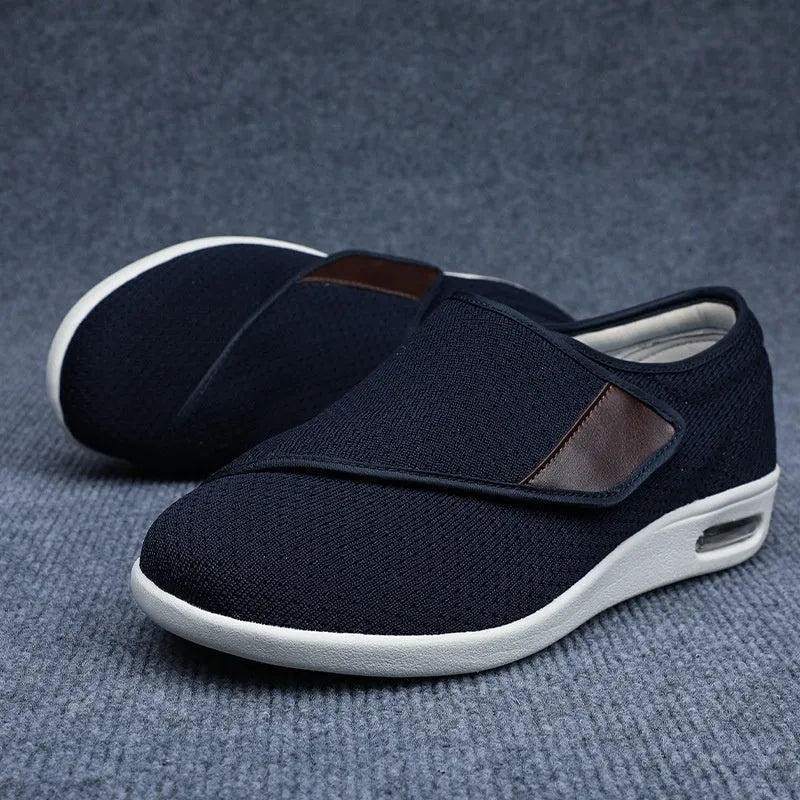 Unisex leisure shoe with hook-and-loop strap on textile upper and foam rubber sole.