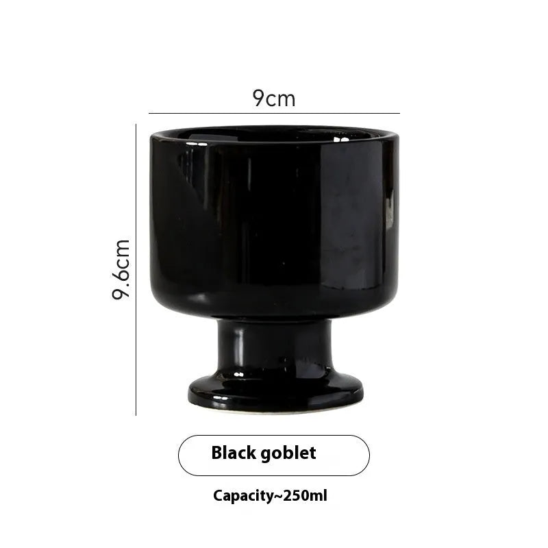 Hand-pinched irregular ceramic mug in a solid colour, showing its unique shape and modern design.