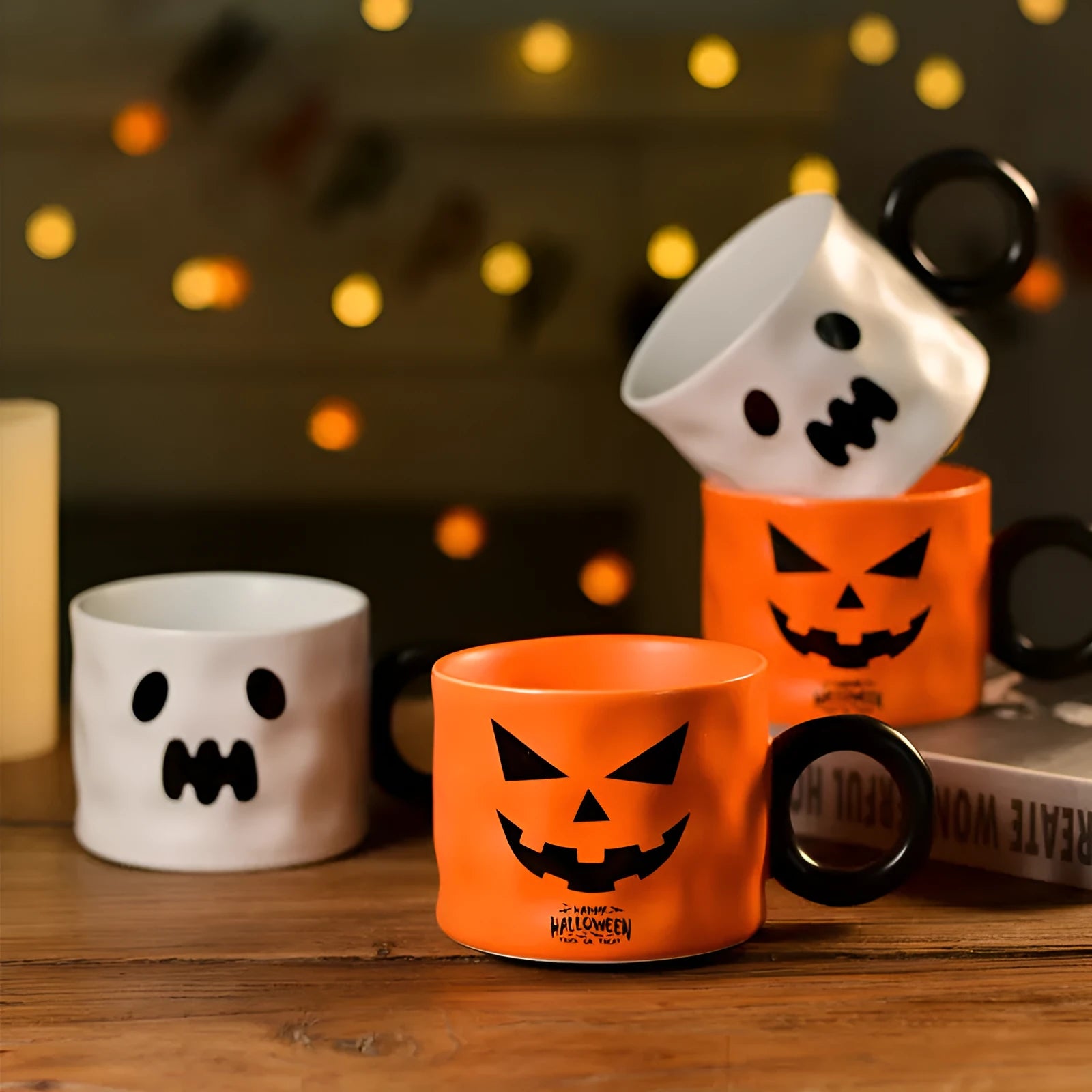 Orange ceramic pumpkin mug with handle on gift box with dessert spoon