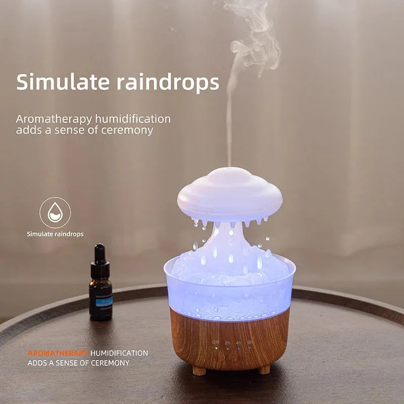 Wood grain white cloud-shaped humidifier diffuser with glowing LED lights and water droplets.