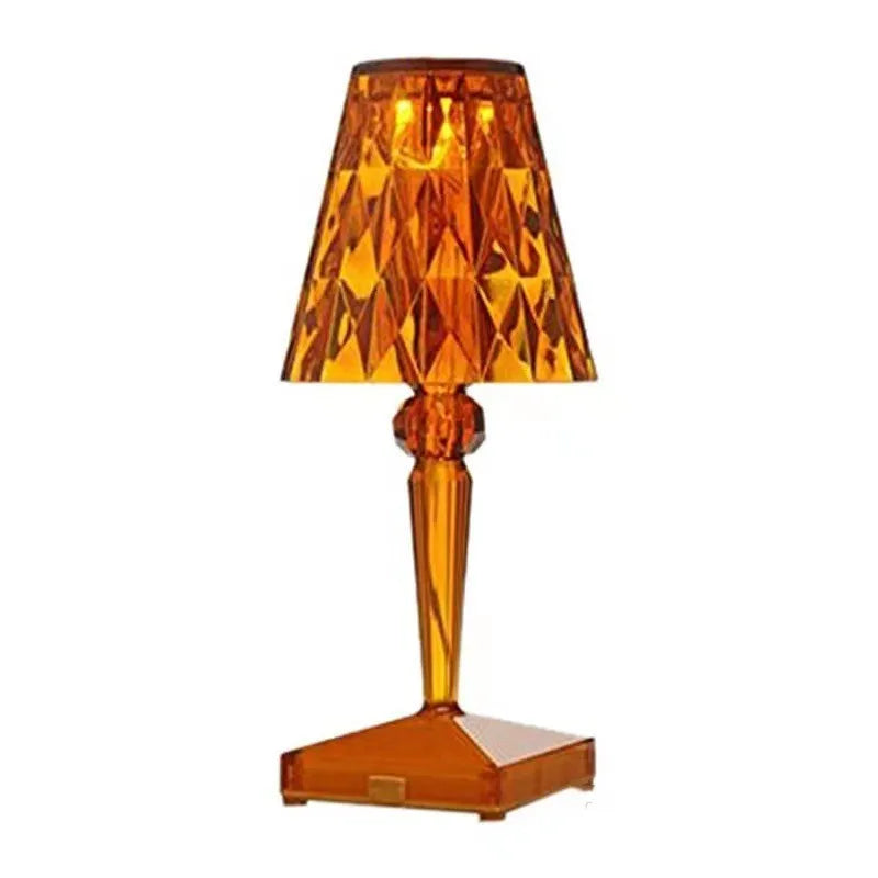 Rose gold portable touch control night light on a surface, showing its acrylic lamp holder.