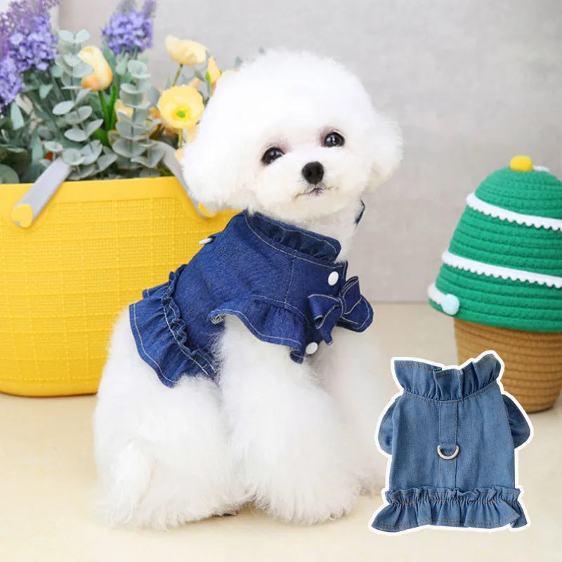 Dark blue denim dog dress with ruffles and a metal leash hook on the chest.