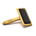 Goldpets bamboo slicker brush with wooden handle and 304 stainless steel pins on a light background