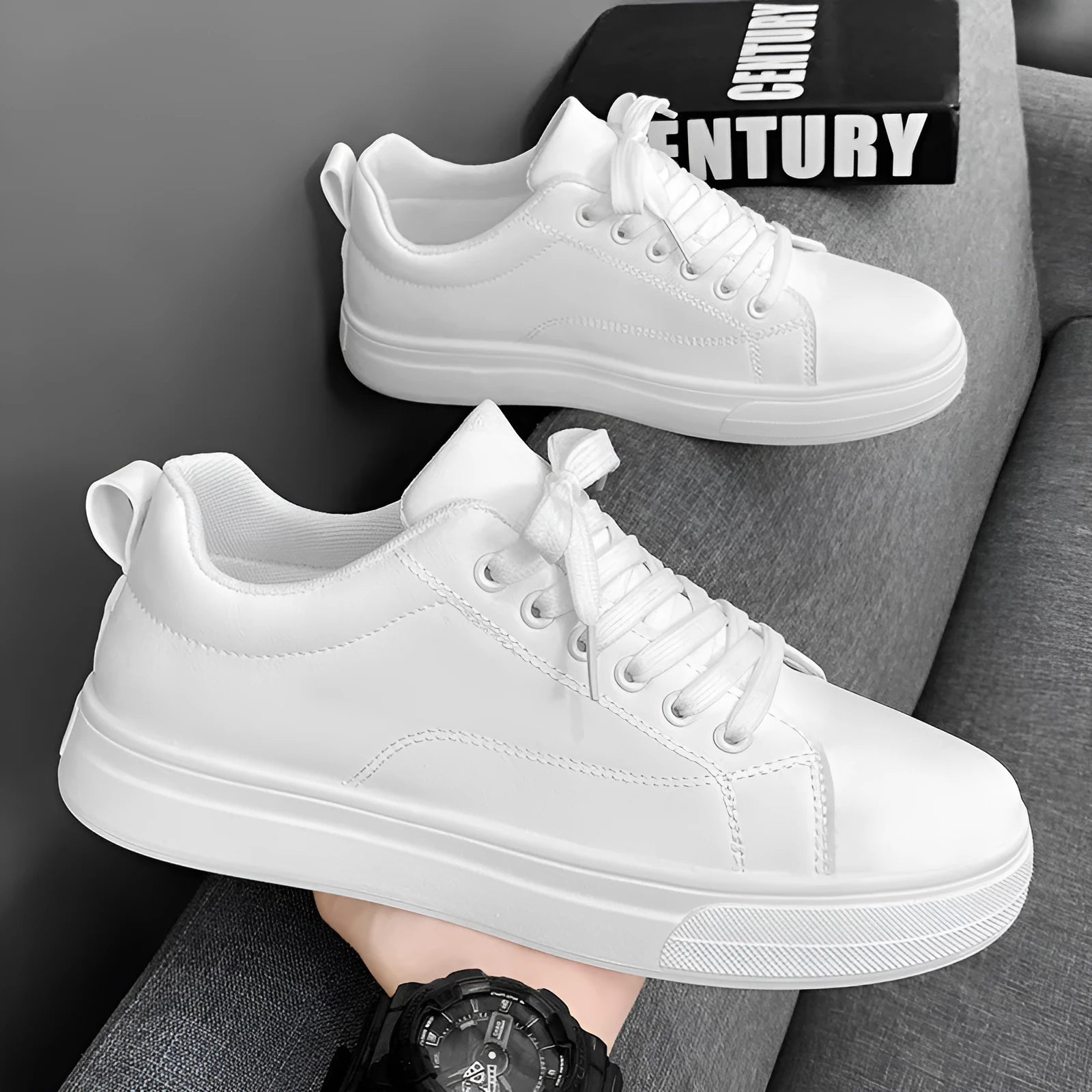 Men's low-top Korean-style casual sneakers in black on white colour with round toe and flat rubber sole.