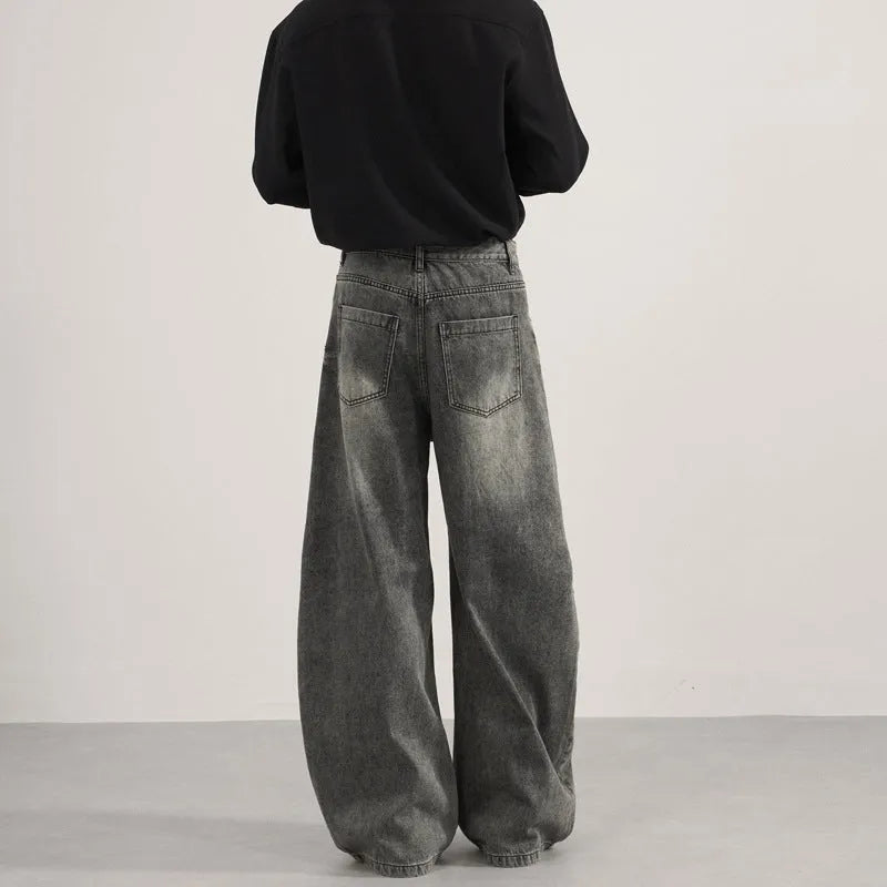 Men's denim straight leg jeans in black and gray washed finish with zip fly