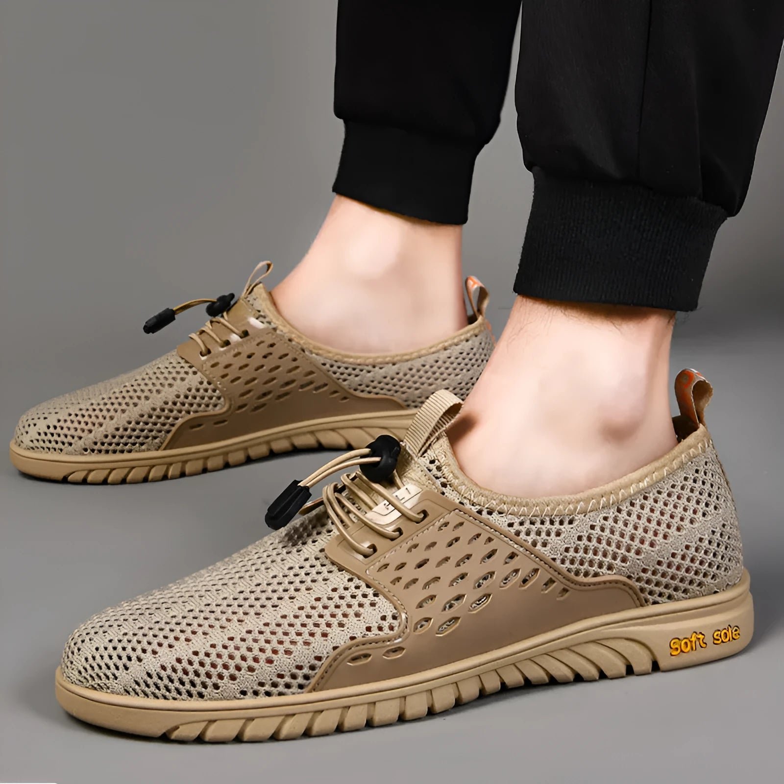 Men's breathable mesh casual sports shoes in black, grey and sand colours with elastic band and rubber sole