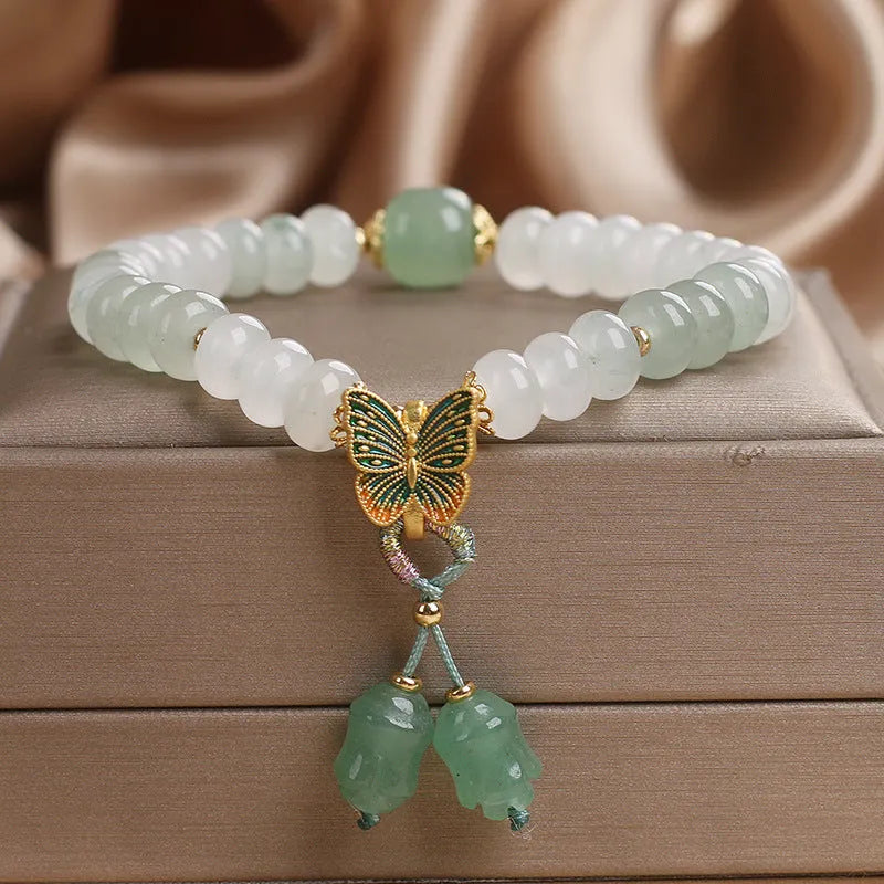 Green jade bracelet with abacus beads and electroplated butterfly tassel decoration