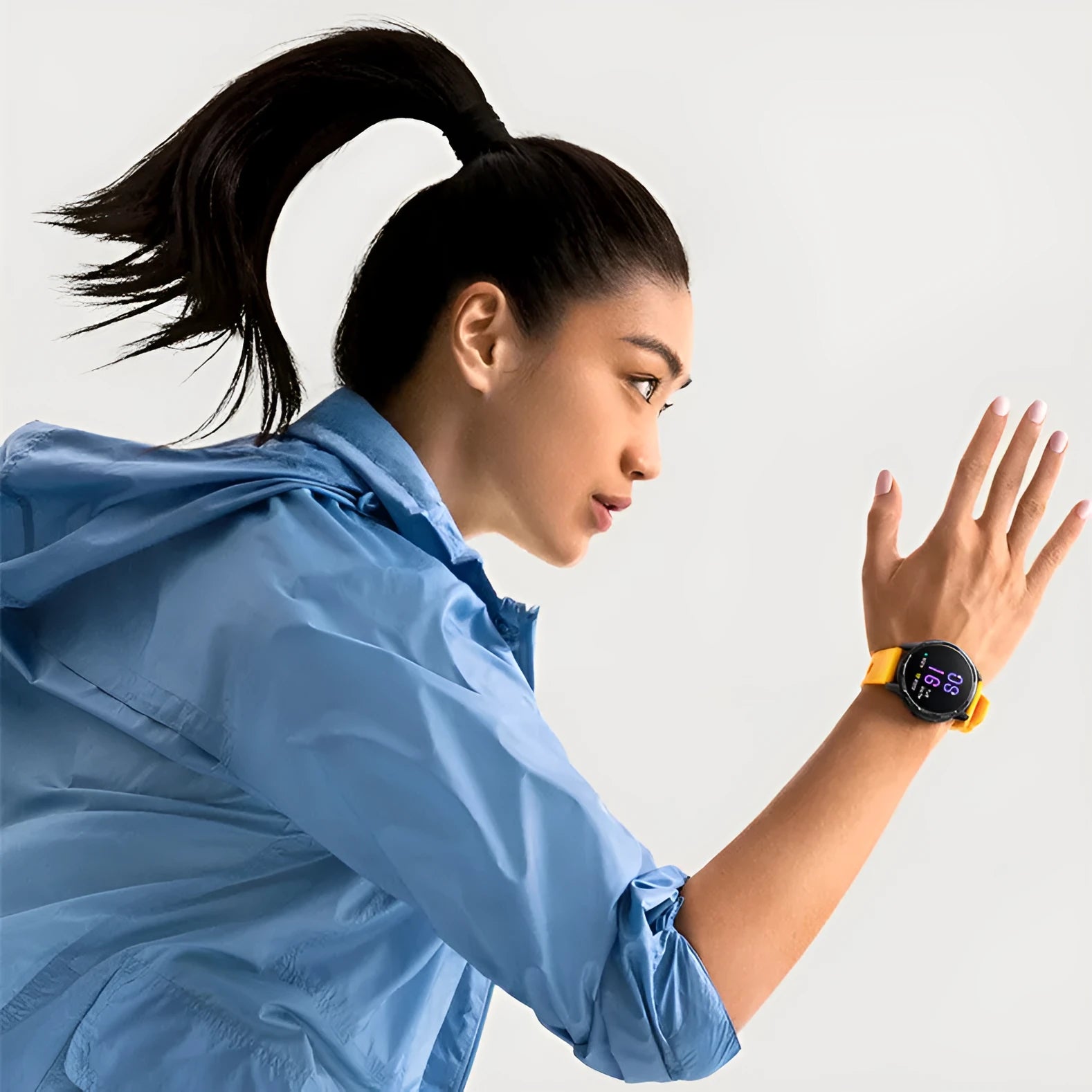 Dual band GPS smart watch with black silicone strap on a wrist, showing the 1.43-inch touchscreen display.
