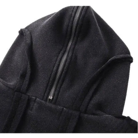 Black loose-fit zip-up hooded coat with an abstract pattern and padding worn as an autumn layer.