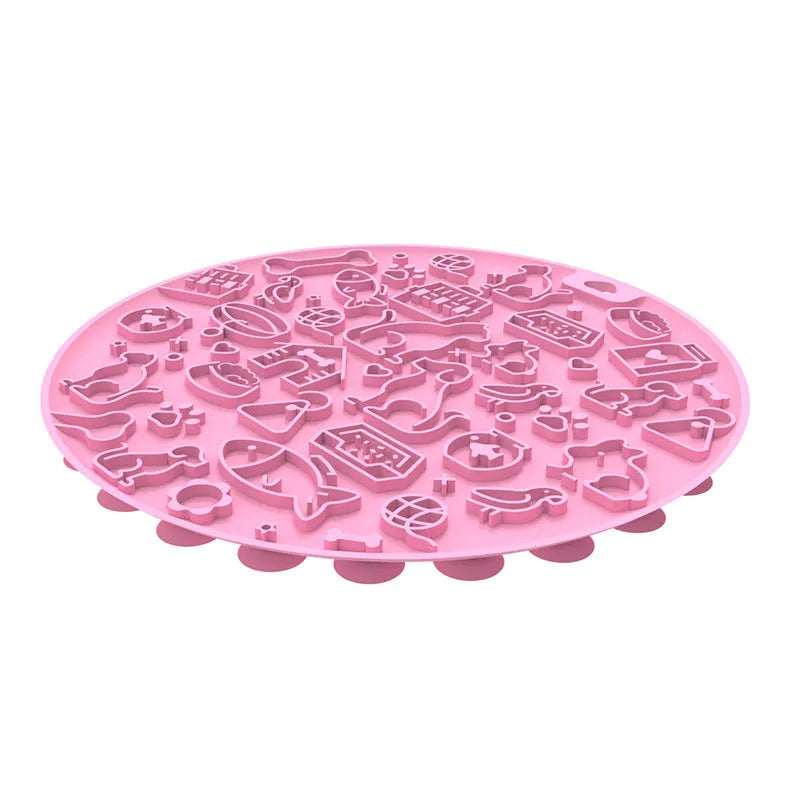 Round grey silicone pet lick mat with suction base on a kitchen floor