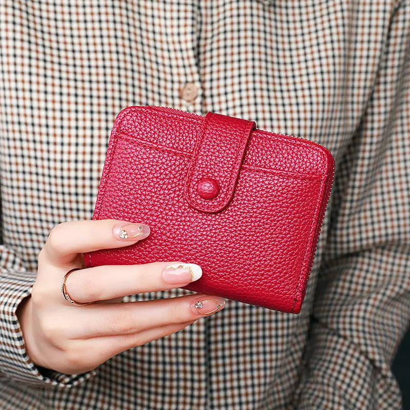 Women's lychee pattern PU short wallet in beige, pink, black, or red with antibacterial lining.