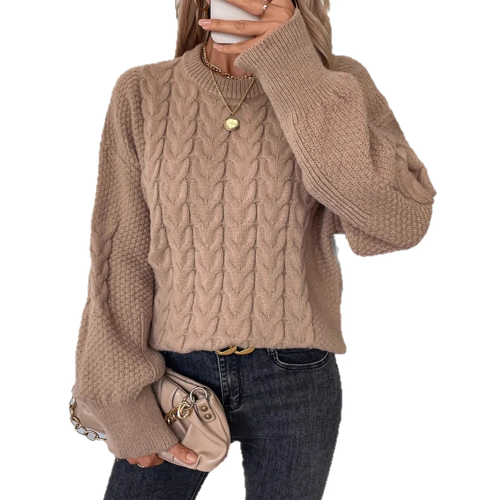Beige women's loose casual sweater with a textured twist detail on the front.