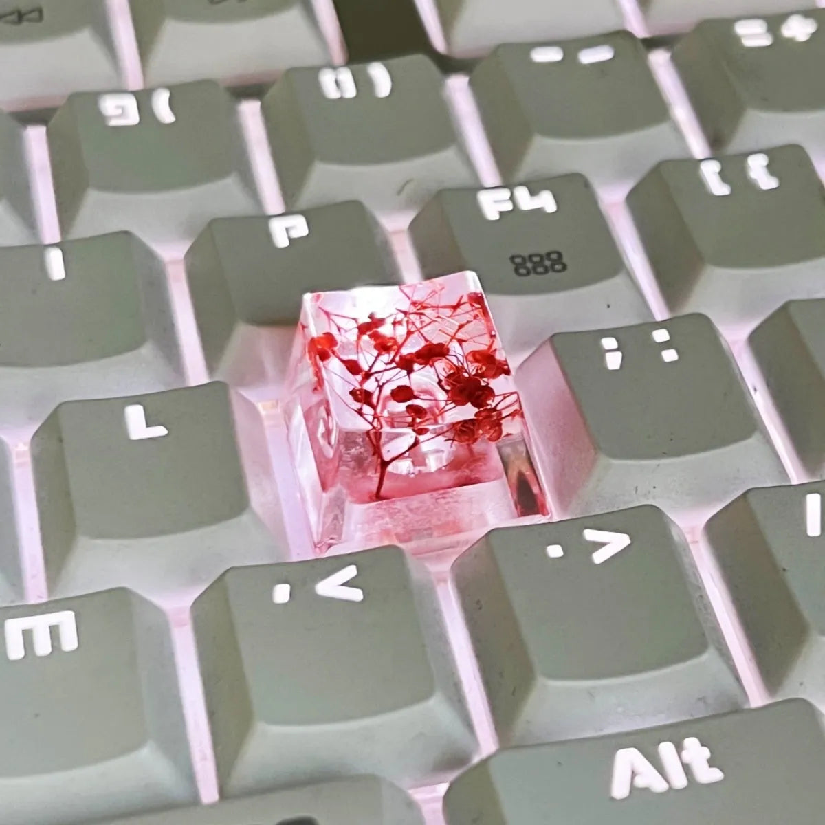 Transparent resin starry sky keycap with glitter particles in red, pink, green, violet colours for mechanical keyboards