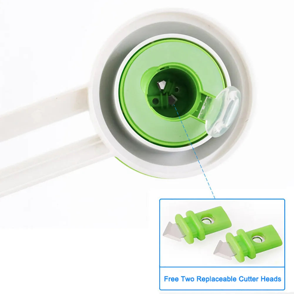 Green and orange plastic round paper cutter for cutting A3 sheets on a desk.