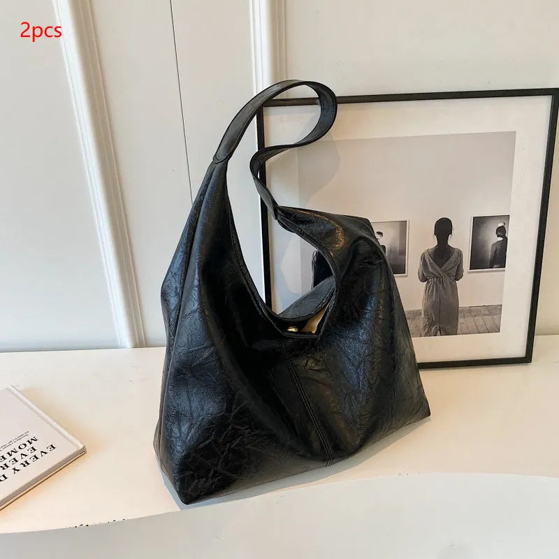 Soft PU leather casual shoulder bag with sandwich pocket in multiple colour options.