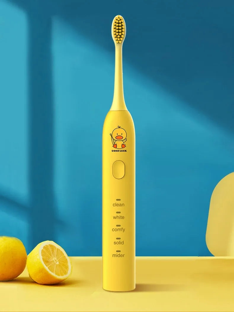 Yellow duck design rechargeable electric toothbrush with soft bristles on a white background.