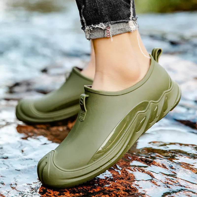 Men's short plastic rain boots in black on white background