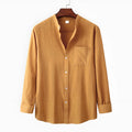 Brown men's slim fit long sleeve shirt and casual trousers on a hanger.