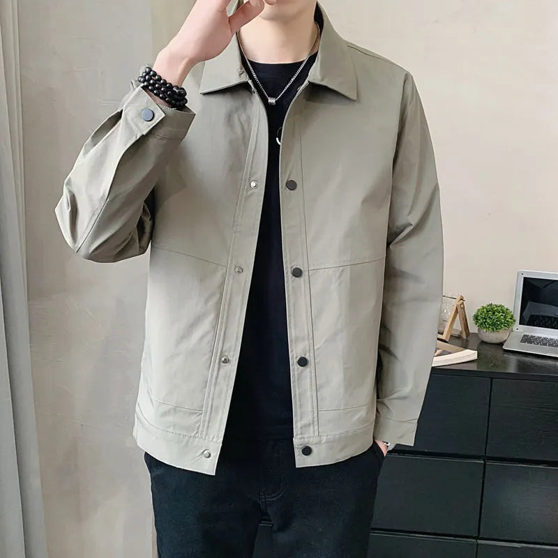 Man wearing a thin, single-layer Korean style jacket in light grey.