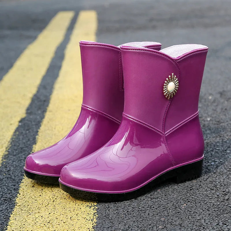 Women's purple PVC rain boots with non-slip sole and middle tube height