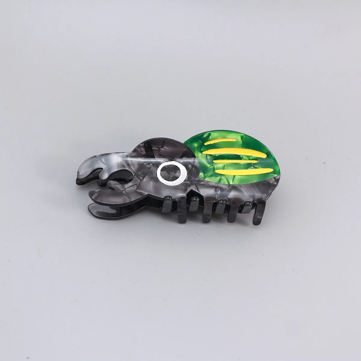 Handmade cellulose acetate beetle hair grip with cartoon caterpillar design in green, orange, or white colour options