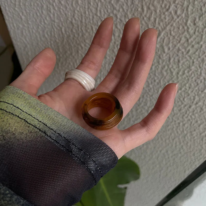 Chinese-style irregular geometric resin ring in brown and white colour options