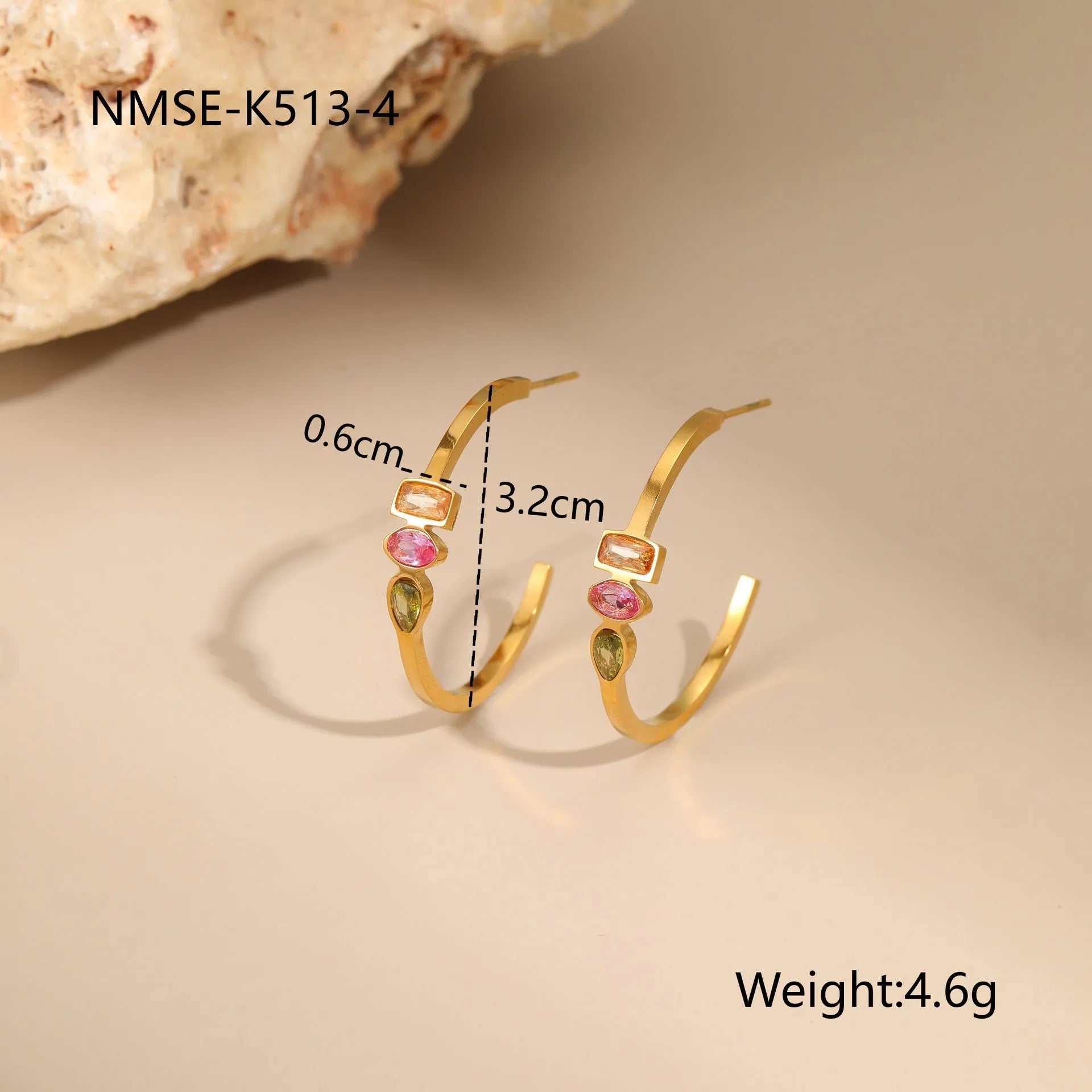 Geometric gold-plated jewellery set with colour zircon stones, showing necklace, ring, and earrings.