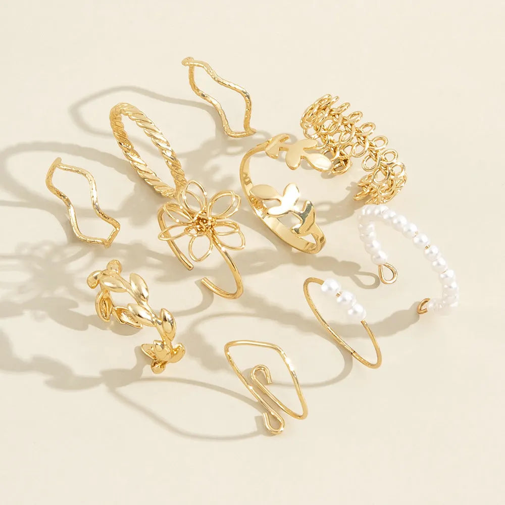 Openwork floral ring set with glossy electroplated finish in gold colour