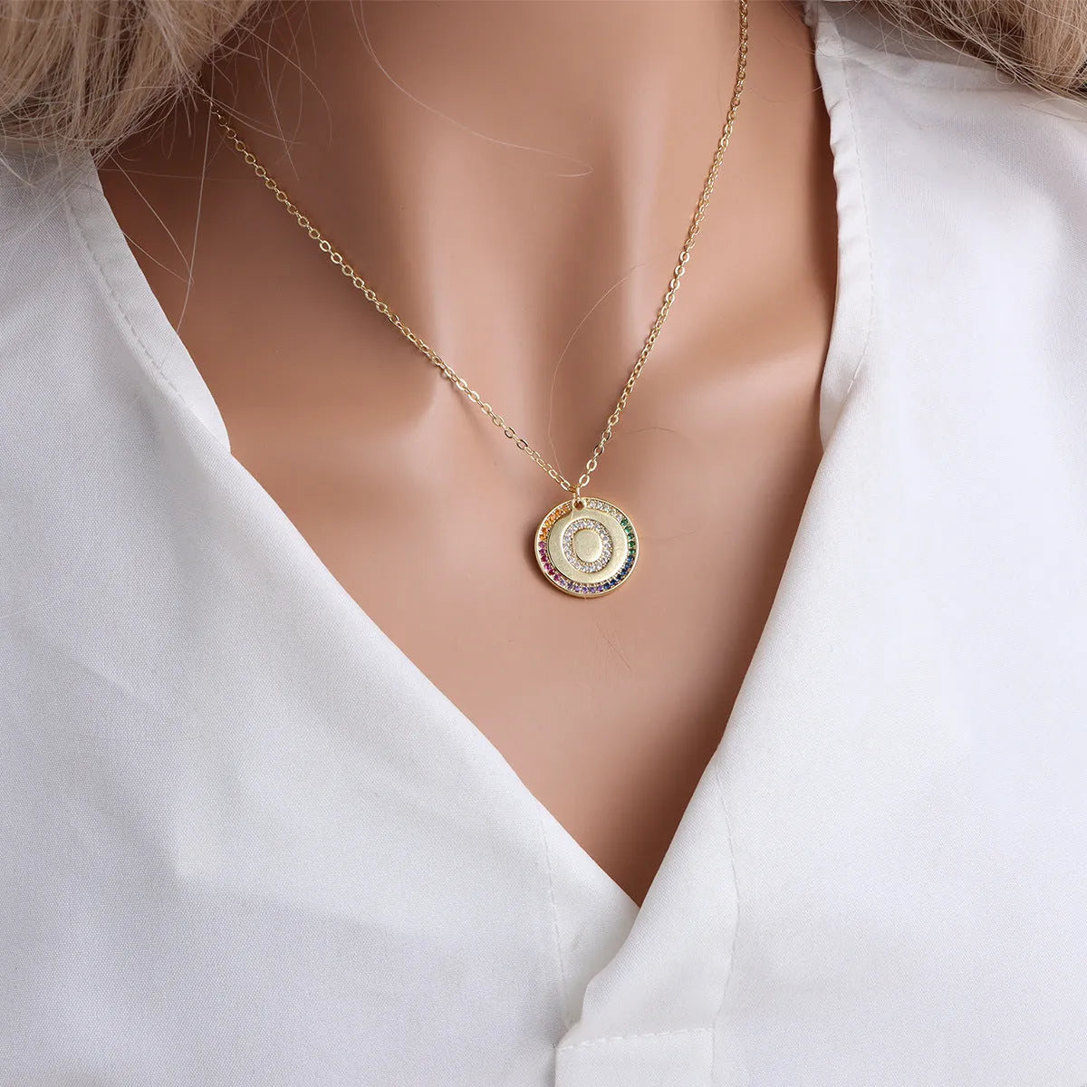 Gold English letter round pendant necklace with colourful crystals on clavicle length chain