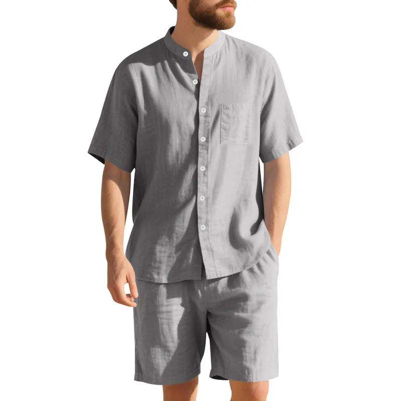 Men's light blue linen blend summer suit with henry collar shirt and shorts on a hanger.