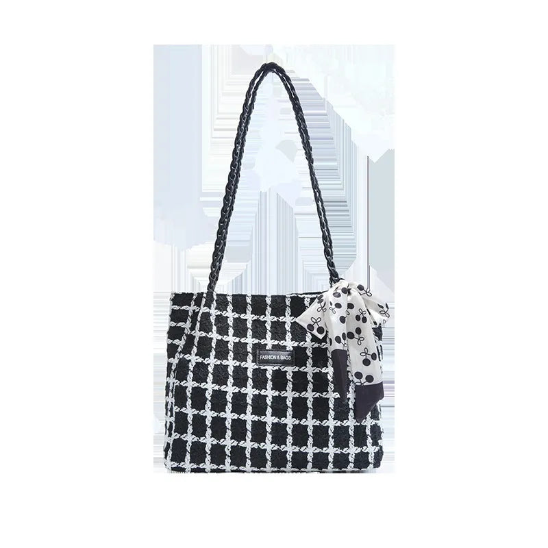 Black woolen horizontal square shoulder bag with weaving detail exterior and internal organisation compartments