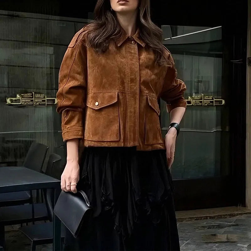 Women's brown suede-style street chic coat with regular sleeves on a hanger.