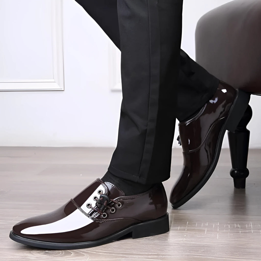Men's black and brown formal business shoes with a square heel and round toe on a rubber sole.