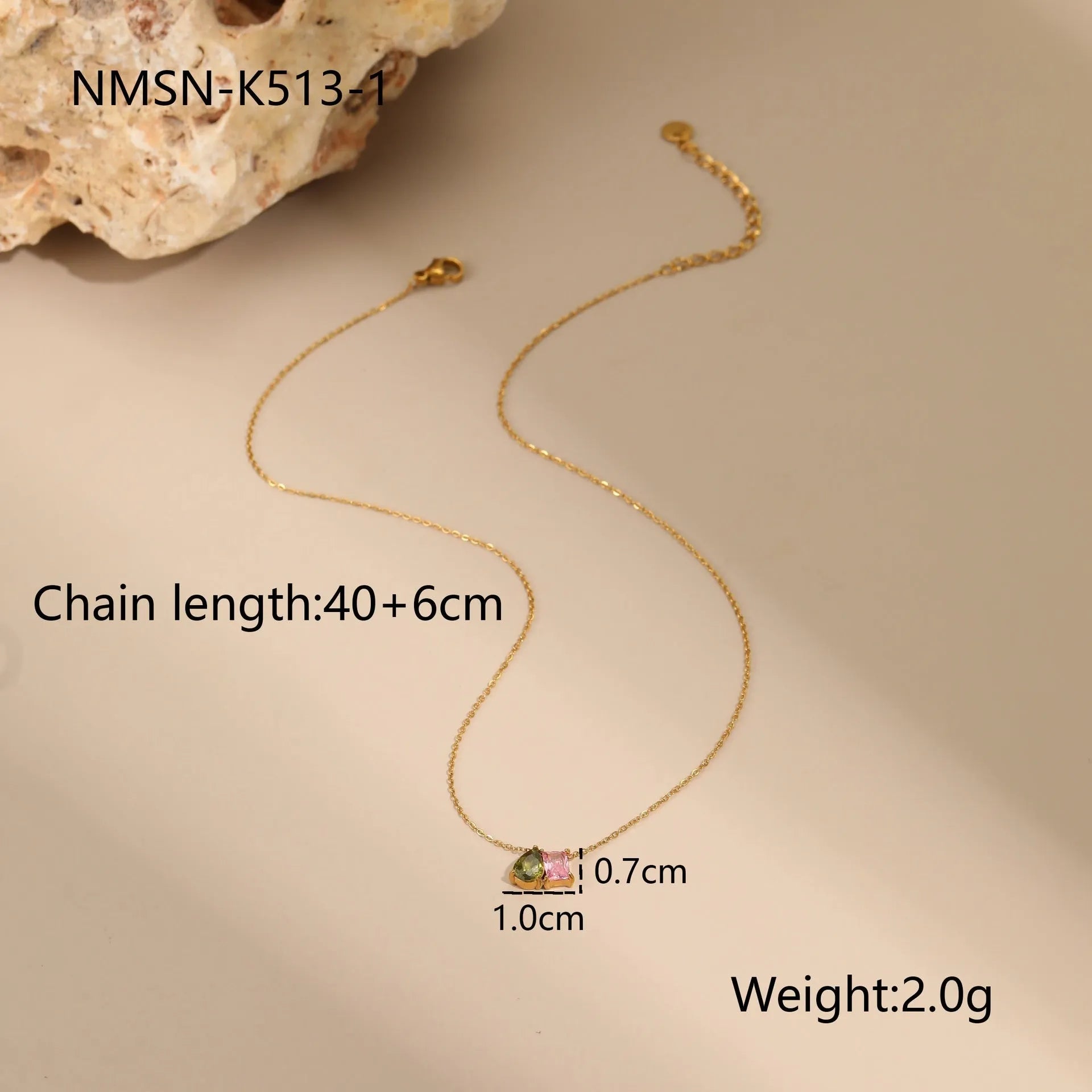 Geometric gold-plated jewellery set with colour zircon stones, showing necklace, ring, and earrings.