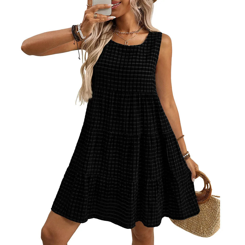 Women's loose sleeveless plaid dress with an oversized swing skirt and high waist.