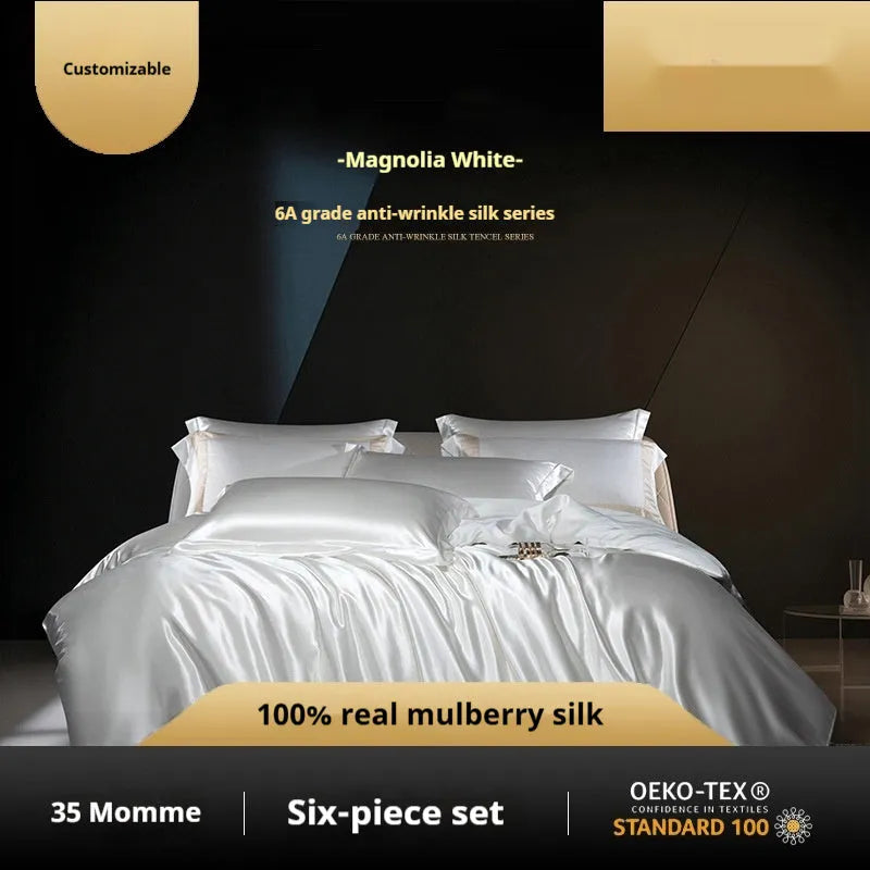 Silk four-piece bed set in a solid colour showing duvet cover and matching pillowcases.