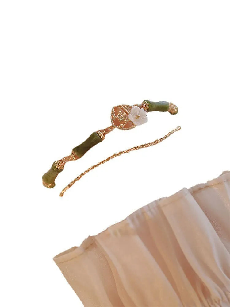 Handmade natural olivine bracelet with Chinese double layer design and olive branch motif.
