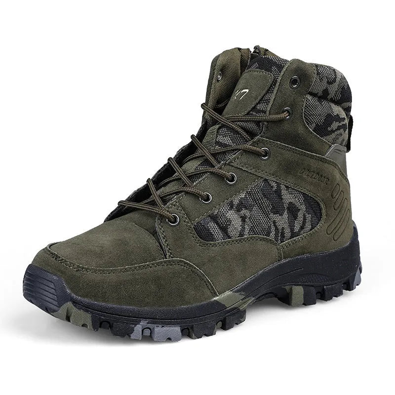 Men's black high-top hiking shoes with metal eyelets on a rocky outdoor path.