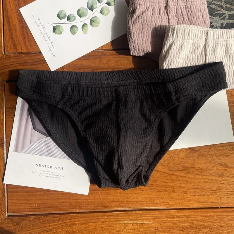 Men's solid colour cotton triangle underwear briefs showing mid waist design and available colour options