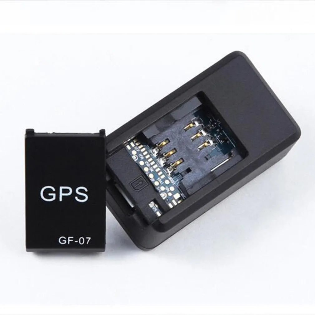 Small black magnetic GPS tracker device with USB cable for real-time vehicle and asset location tracking.